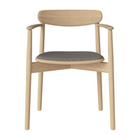 Light wooden chair with a sleek, rounded back and a charcoal gray patterned seat. Ideal for modern decor.