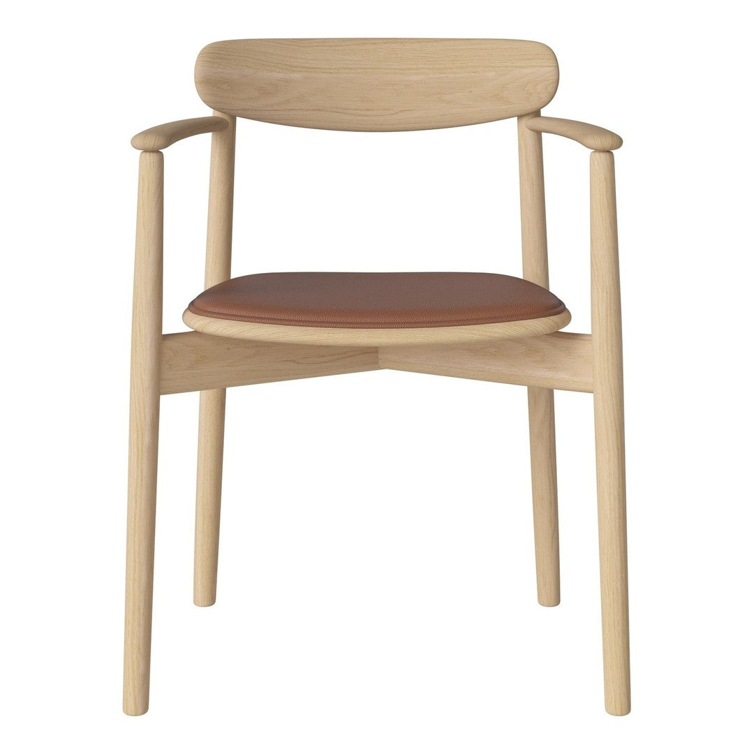 Light wood chair with a simple design and a warm, tan leather seat. Clean lines and natural finish.