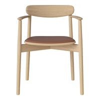 Light wood chair with a simple design and a warm, tan leather seat. Clean lines and natural finish.