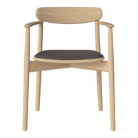 Light oak chair with a minimalist design, featuring a dark gray seat cushion and smooth rounded edges.