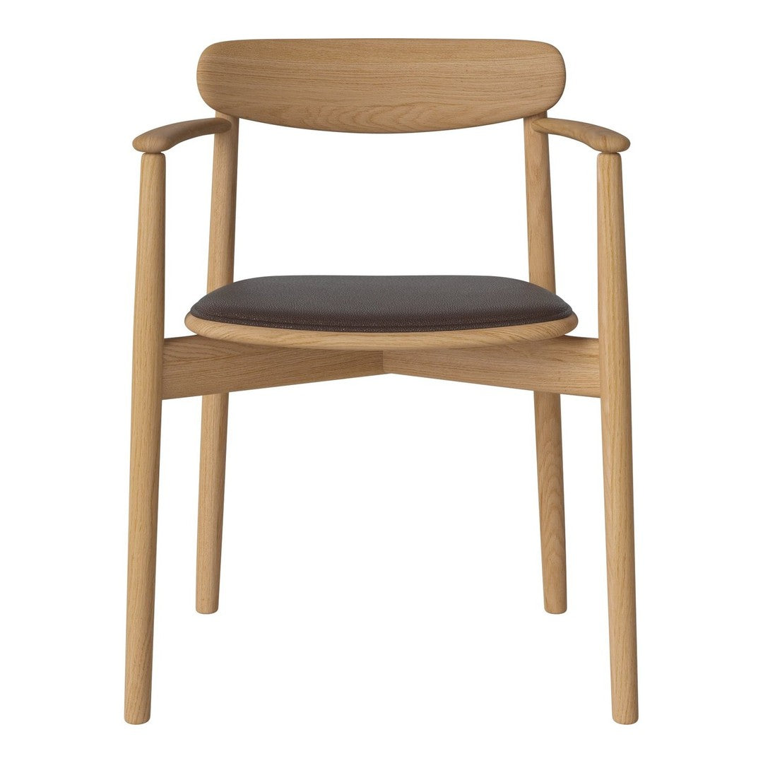 Natural wood chair with a light oak finish and a sleek black leather seat. Minimalist design, elegant curves.
