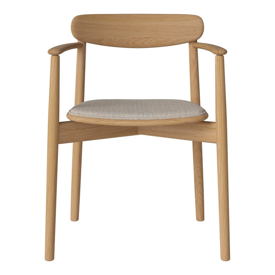 Light wood chair with a beige patterned seat and smooth, minimalist design. Elegant and modern aesthetic.