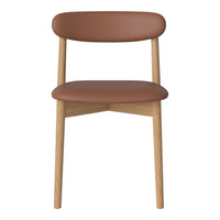 Brown leather chair with a minimalist design and natural wood legs. Simple, modern aesthetics for any space.