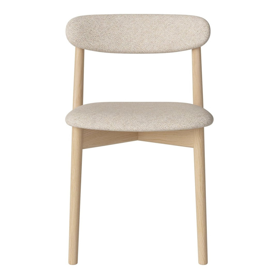 Light beige upholstered chair with a minimalist design and smooth wooden legs.