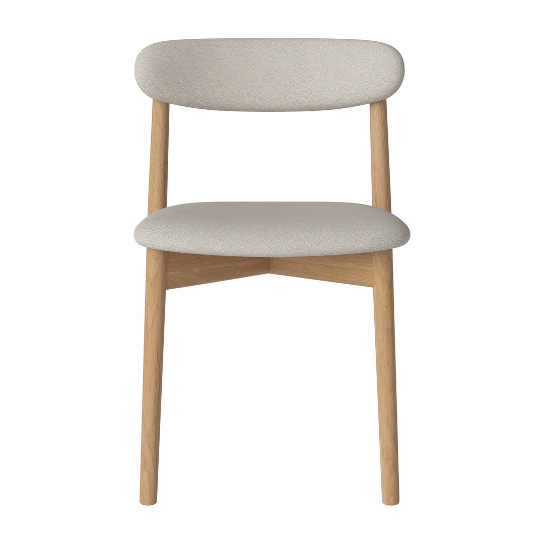 Light gray upholstered dining chair with natural wood legs, featuring a minimalist design and soft curves.