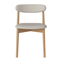 Light gray upholstered dining chair with natural wood legs, featuring a minimalist design and soft curves.