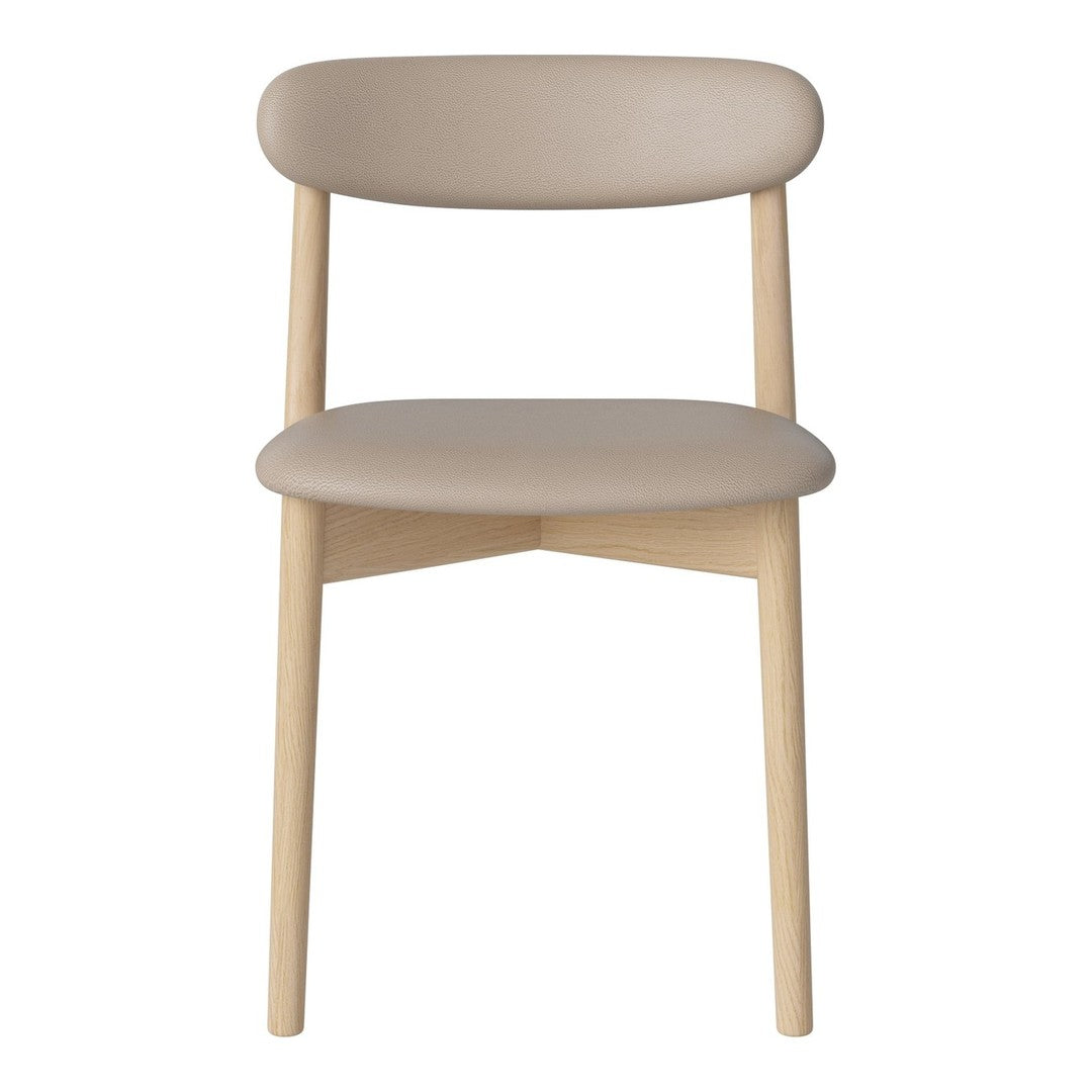 Beige upholstered chair with smooth, curved lines and natural wooden legs. Modern minimalist design with soft color palette.