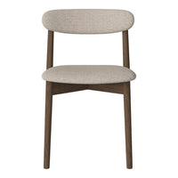 Beige upholstered chair with a simple, modern design and dark wood legs, featuring a smooth, textured surface.