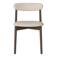 Minimalist beige upholstered chair with a smooth texture and dark wooden legs, perfect for modern interiors.