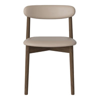 Beige upholstered chair with a smooth finish and a natural wood frame, featuring simple, modern design elements.