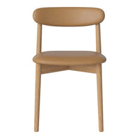 "Minimalist beige chair with smooth, rounded contours and natural wood legs, showcasing a modern design."