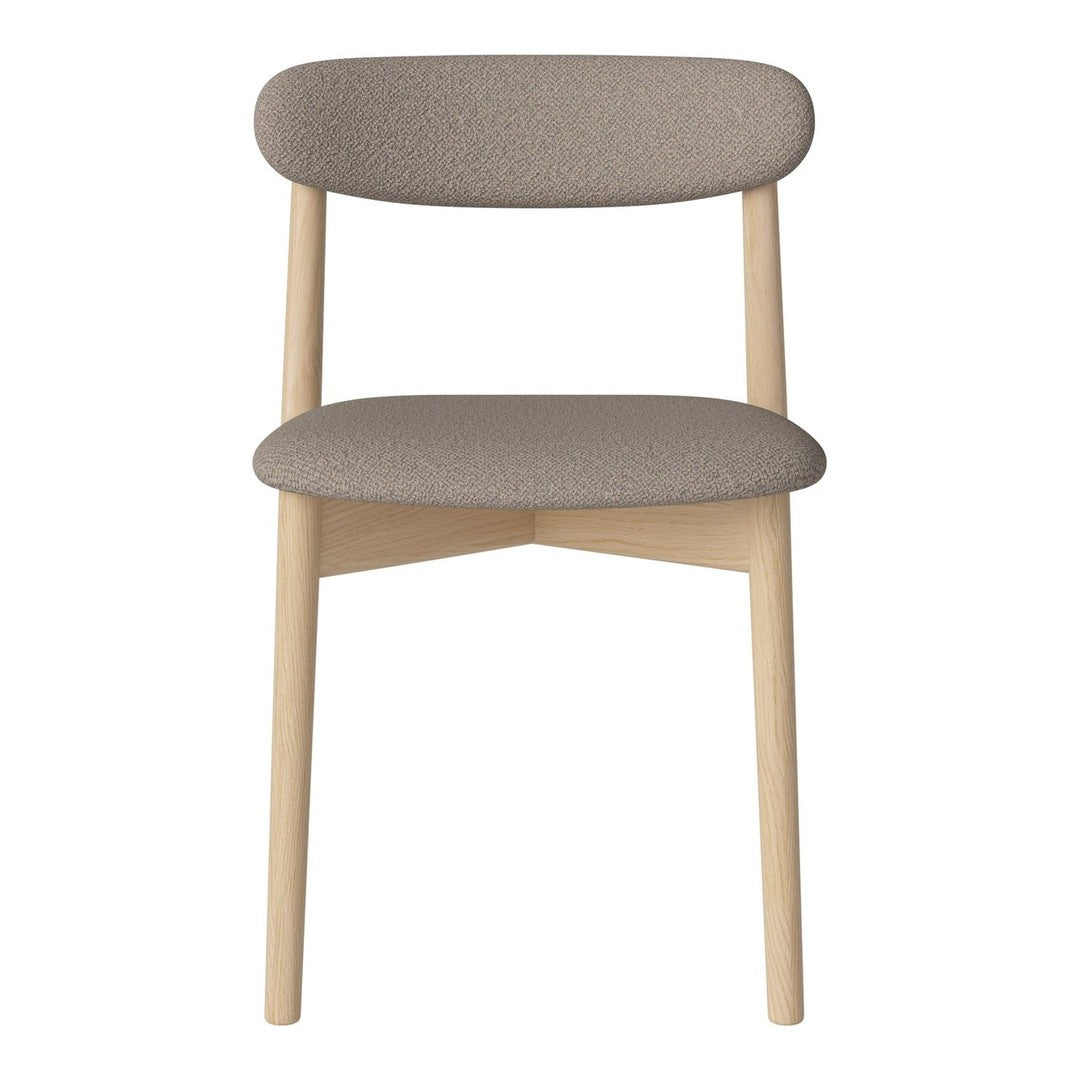 Minimalist chair with a light wood frame and soft gray upholstery, featuring a smooth, streamlined design.
