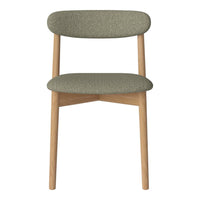 Green upholstered chair with rounded backrest and natural wood legs, featuring a smooth, textured fabric pattern.