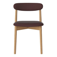 Burgundy upholstered chair with minimalistic design and natural wooden legs, perfect for modern decor.