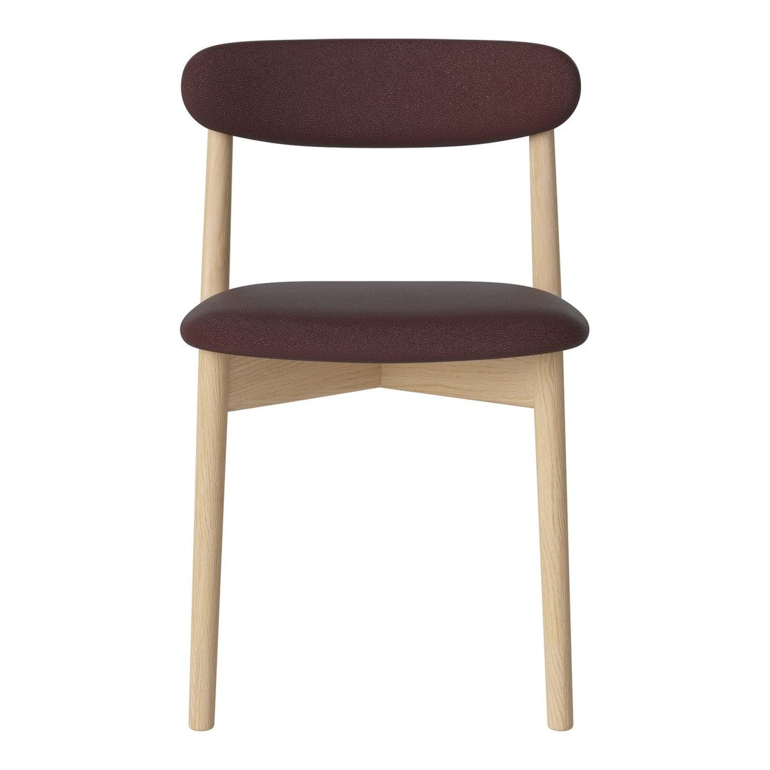Burgundy upholstered chair with natural wood legs, featuring a minimalist design and smooth lines.