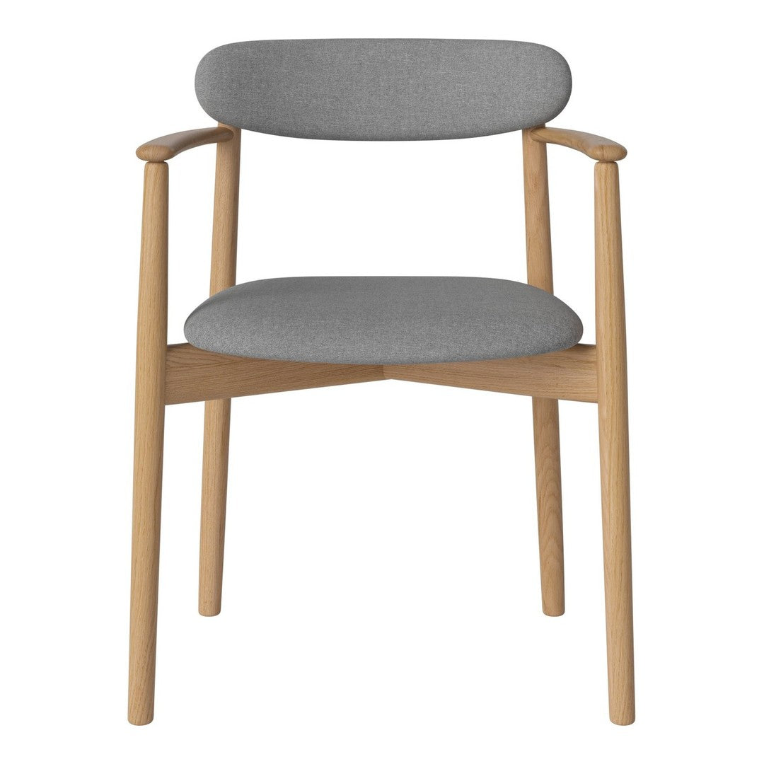 Gray upholstered chair with a minimalist design and natural wood frame. Perfect for modern interiors.
