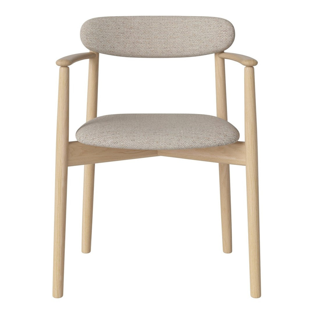 Light beige chair with soft textured fabric and natural wood legs, showcasing a minimalist design and neutral color palette.