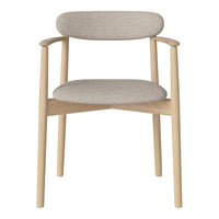 Light beige chair with soft textured fabric and natural wood legs, showcasing a minimalist design and neutral color palette.