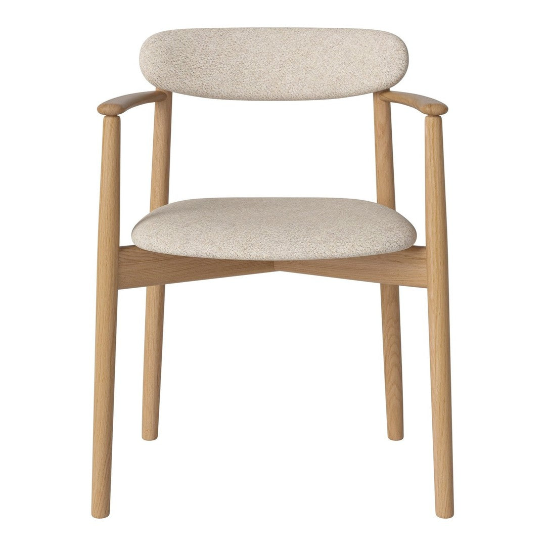 Light beige upholstered chair with natural wood frame, showcasing a minimalist design and soft texture.