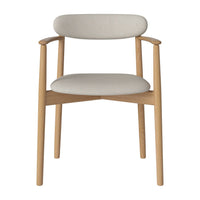 Light beige fabric upholstery with natural wood accents on a minimalist chair design.
