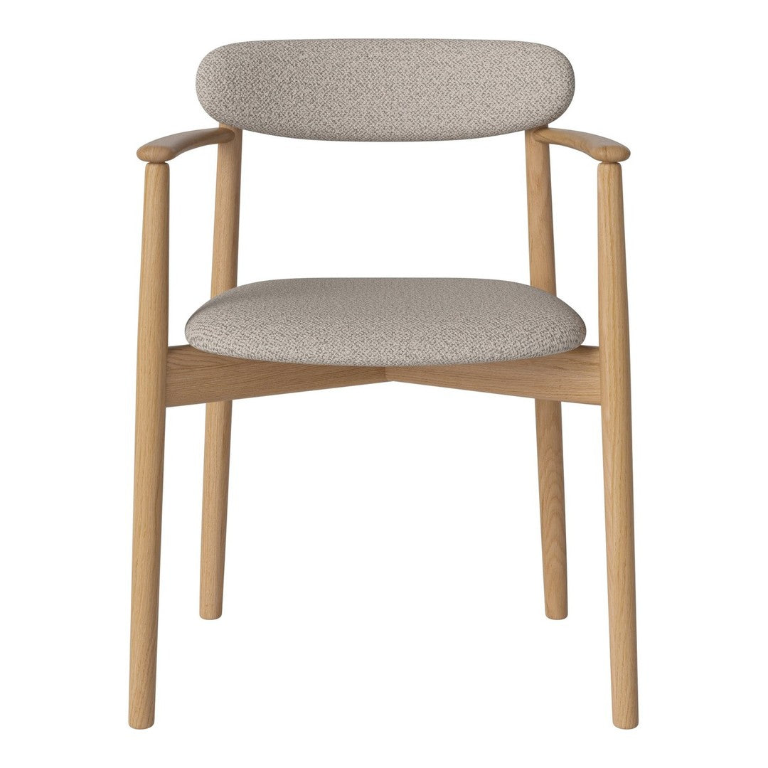 Light beige fabric chair with a smooth texture and natural wood accents, showcasing a modern, minimalist design.