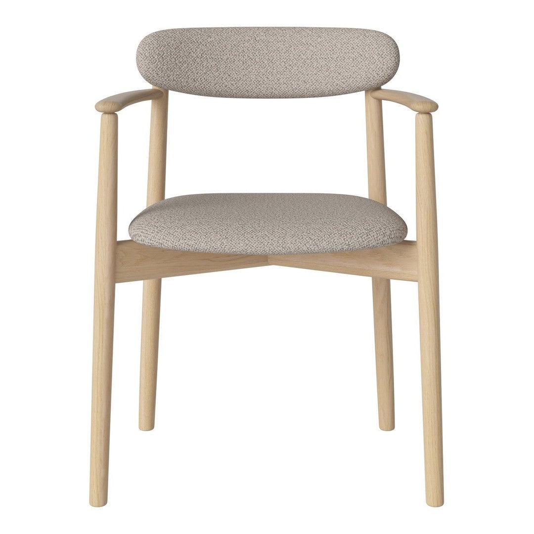 Light beige upholstered chair with a soft textured pattern and natural wood frame. Modern and minimalist design.