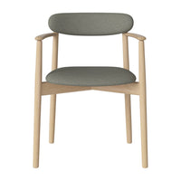 Stylish grey upholstered chair with natural wood frame, featuring a minimalist design and soft, smooth curves.