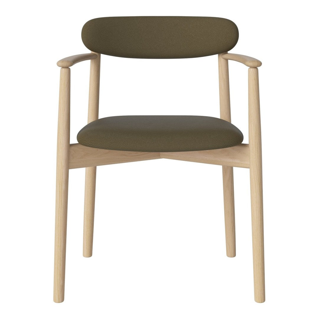 Green upholstered chair with light wood legs and a minimalist design. Stylish and modern home décor accent.