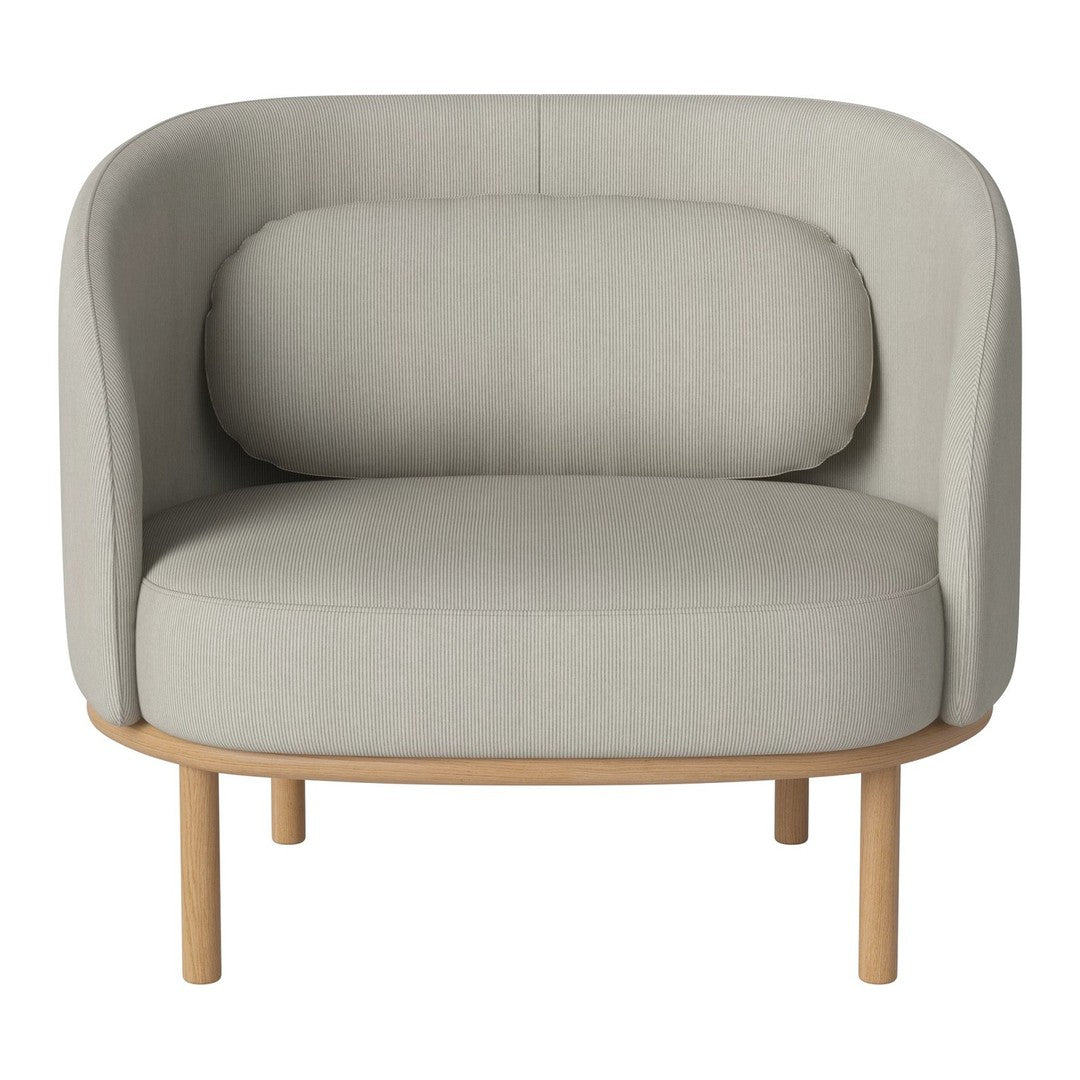 Light gray upholstered armchair with rounded shapes and a natural wood base. Soft, minimalist design for modern decor.