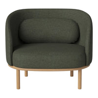 Green patterned armchair with a rounded design and light wood legs, perfect for modern decor.