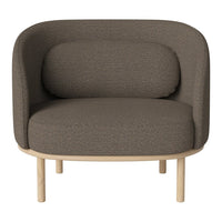 "Cozy brown chair with smooth fabric and curved design, complemented by light wooden legs."