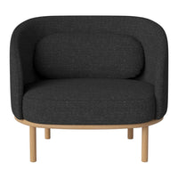 Modern, curved armchair in dark gray fabric with a smooth wooden base, featuring a minimalist design.