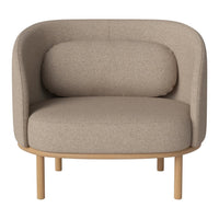 Beige upholstered chair with a smooth, rounded design and light wood legs, perfect for modern interiors.