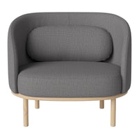 Curved gray upholstered chair with subtle texture and light wood legs, ideal for modern interiors.