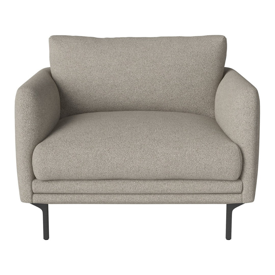 Light beige armchair with a textured fabric and sleek black metal legs. Ideal for modern and cozy interiors.