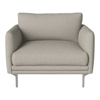 Light beige armchair with a smooth texture and minimalist design, featuring plush cushions and silver metal legs.