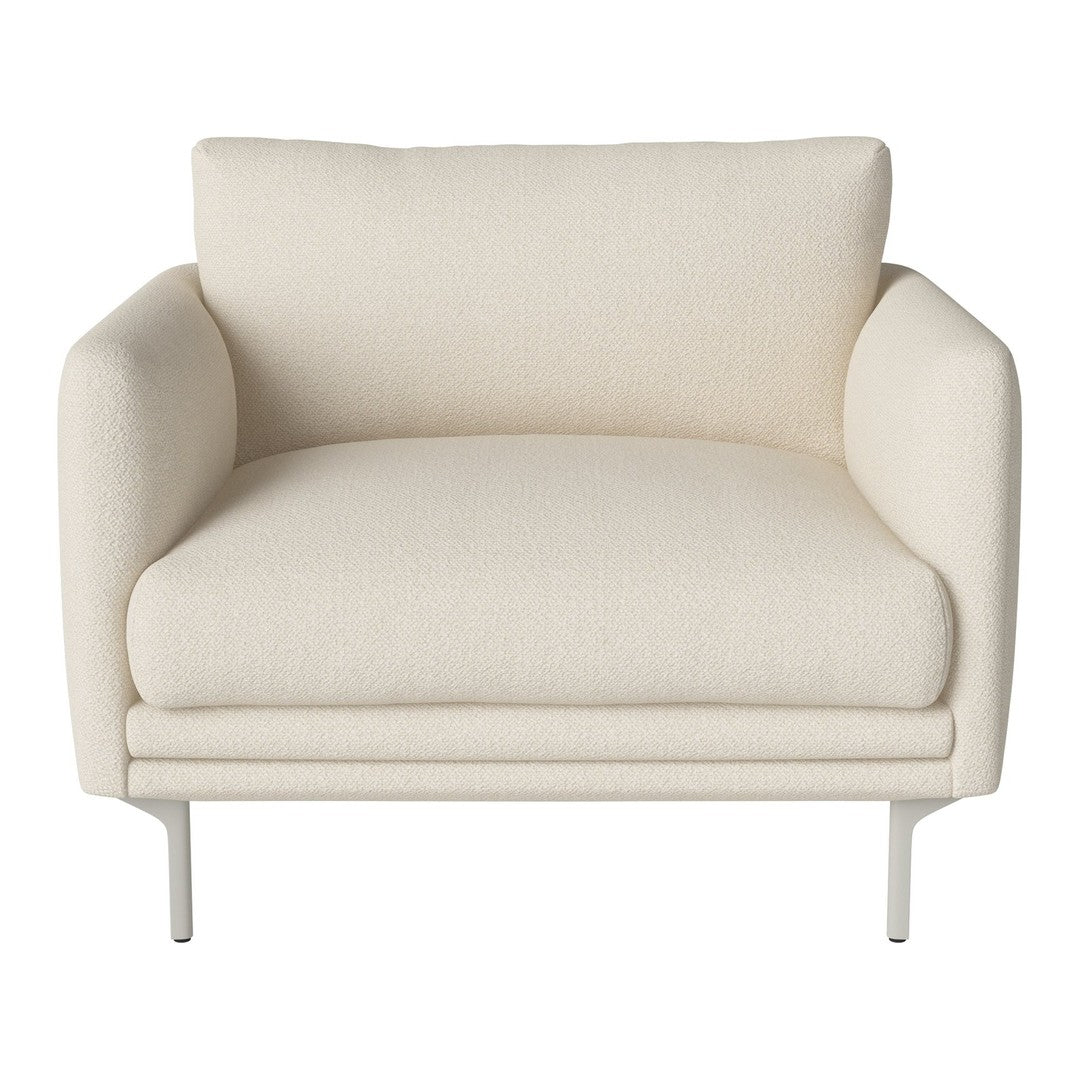 Cream-colored lounge chair with a smooth, minimalist design and soft, textured upholstery. Modern and stylish addition.