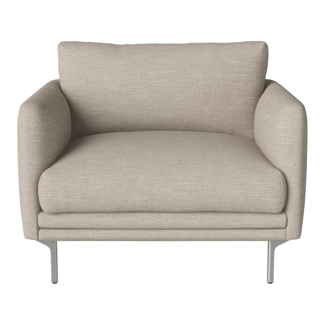 Beige upholstered accent chair with smooth texture and sleek silver legs, creating a modern, minimalist aesthetic.
