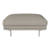 Beige upholstered ottoman with a smooth, curved silhouette and sleek metal legs, perfect for modern decor.