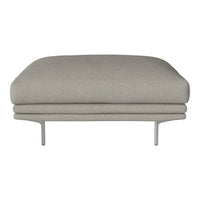 Gray upholstered ottoman with a smooth, minimalist design and subtle texture, supported by sleek metal legs.