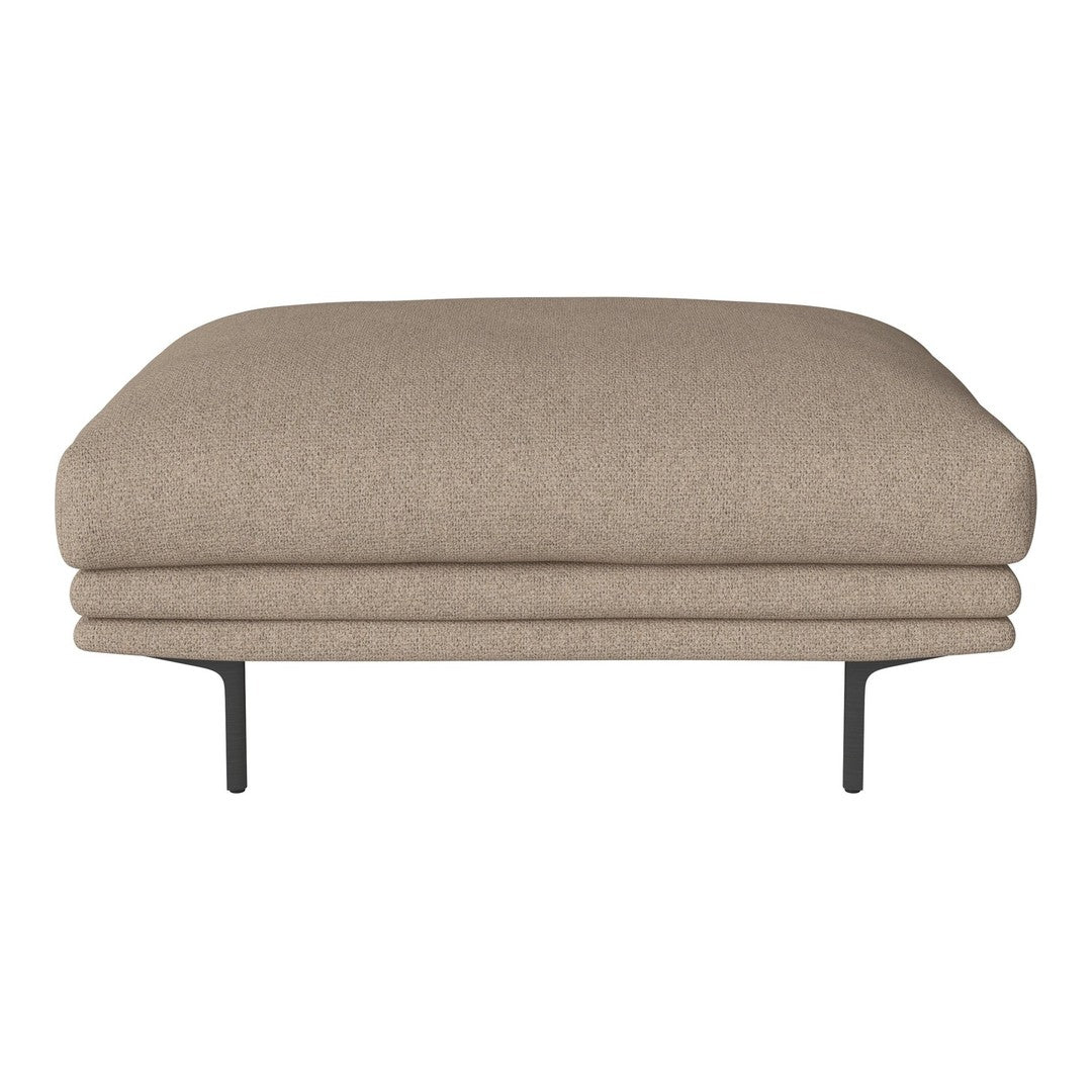 Beige upholstered ottoman with a smooth, rounded top and sleek black metal legs. Minimalist design and warm neutral tones.