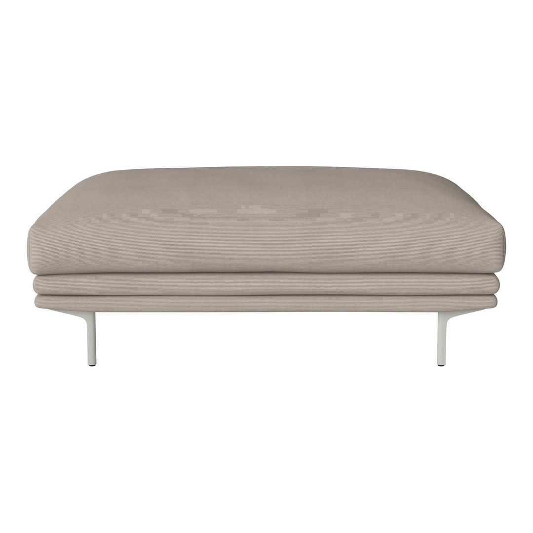 Sleek beige upholstered sofa with a smooth, minimalist design, featuring elegant metal legs.