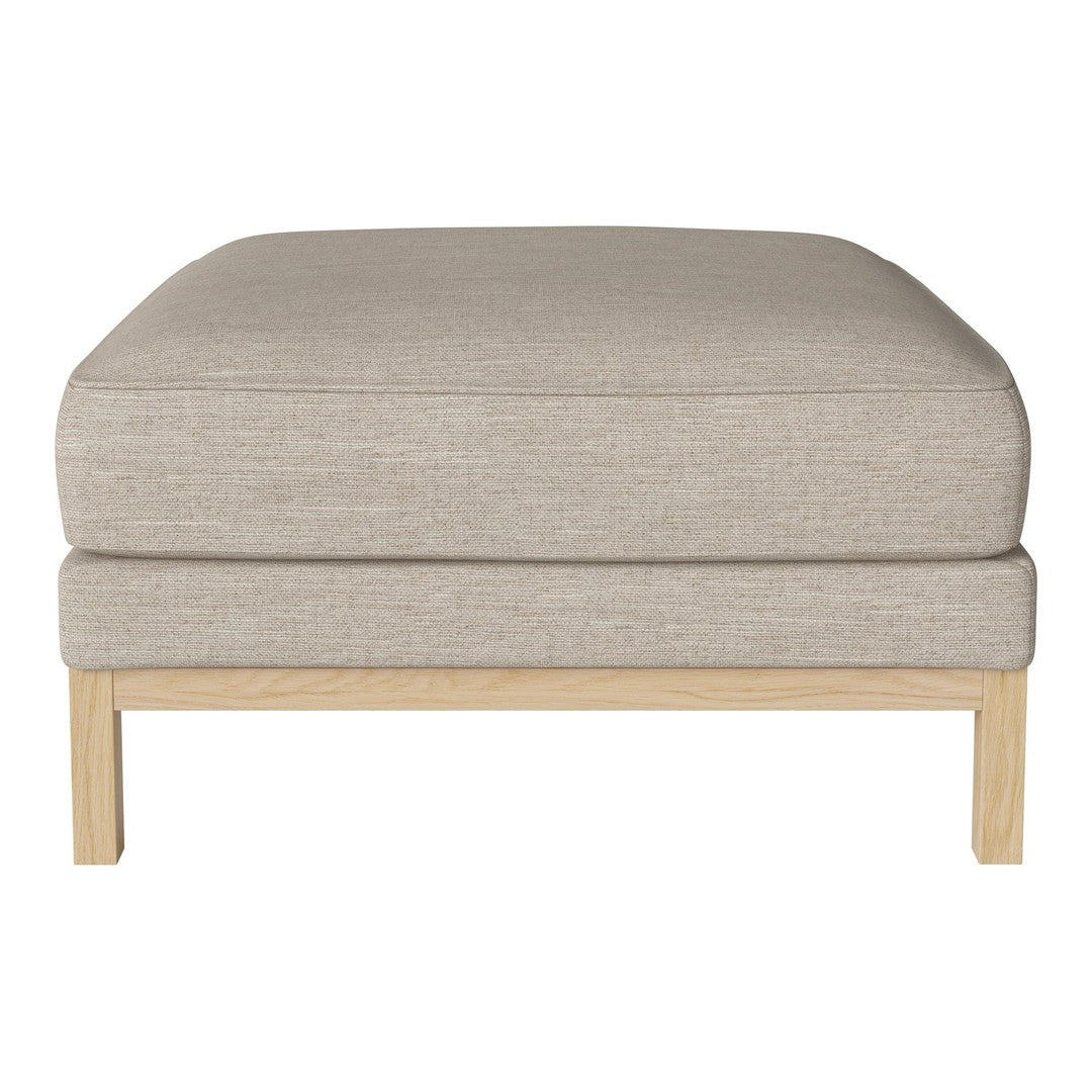 Light beige upholstered ottoman with a smooth, plain fabric and natural wood legs. Modern and minimalist design.
