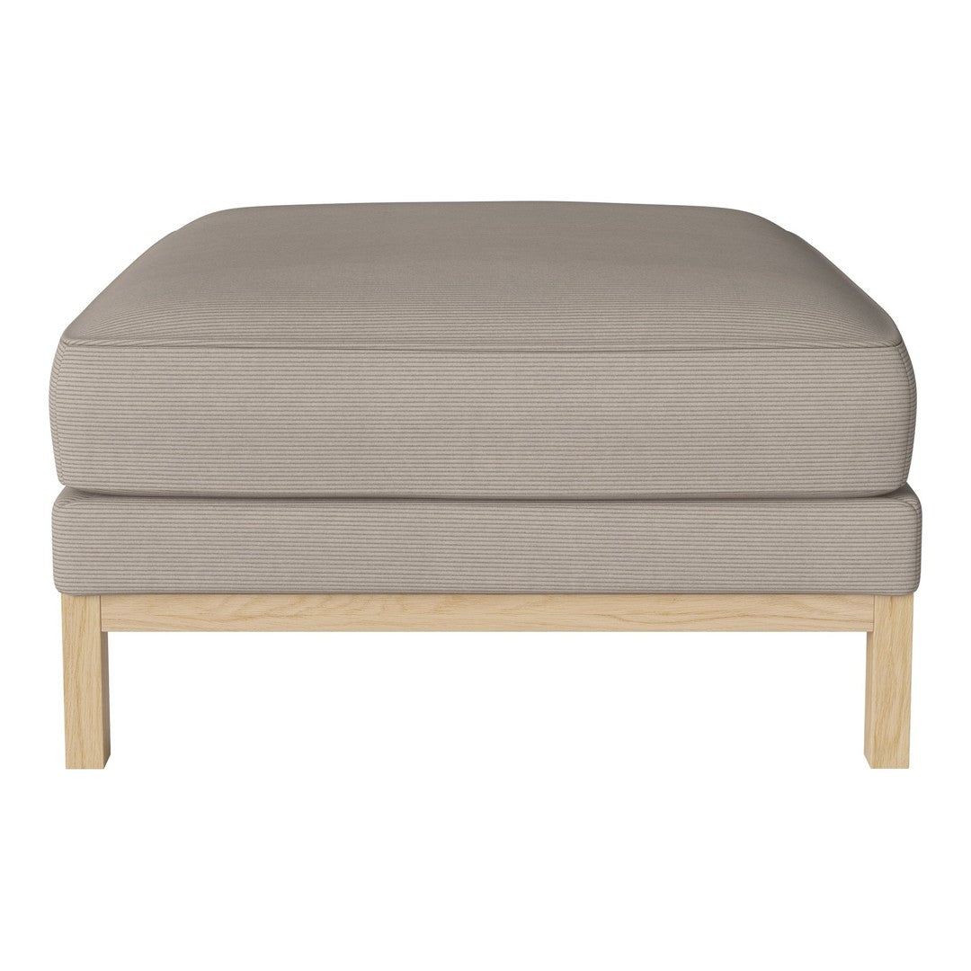 Light beige upholstered ottoman with a smooth, soft surface and natural wood legs. Simple, modern design.