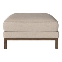 Beige upholstered ottoman with a smooth texture and wooden legs, perfect for contemporary decor.