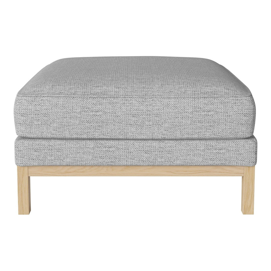 Gray upholstered ottoman with a textured fabric and natural wood legs, perfect for modern decor.