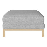 Gray upholstered ottoman with a textured fabric and natural wood legs, perfect for modern decor.