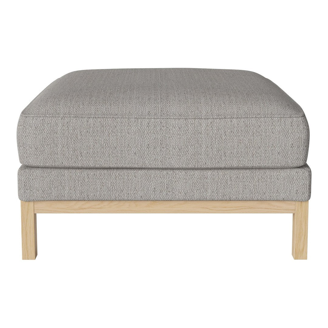 Gray textured ottoman with a minimalist design, featuring a light wooden frame. Perfect for modern decor.