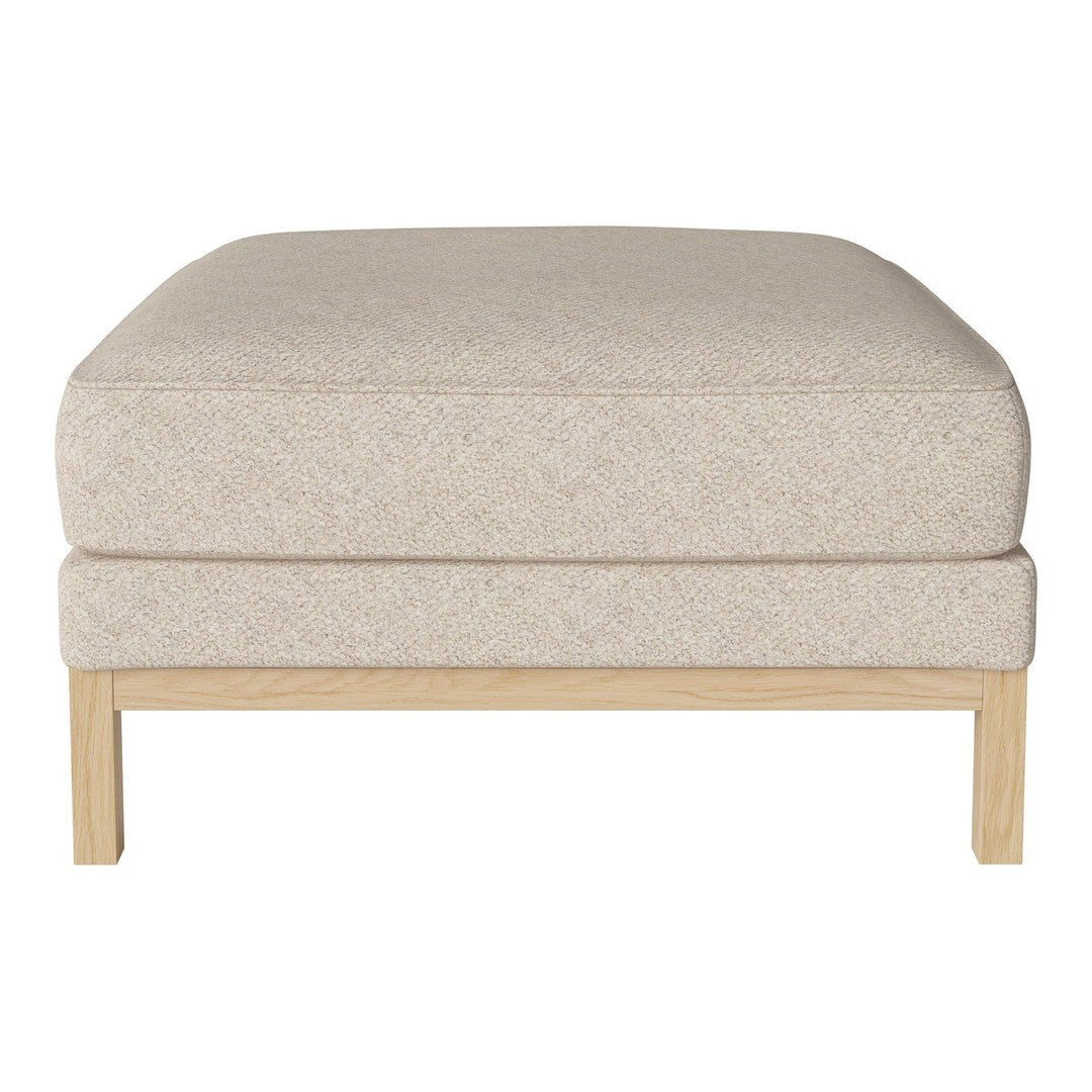 Beige upholstered ottoman with a textured pattern and natural wood legs. Ideal for modern decor.