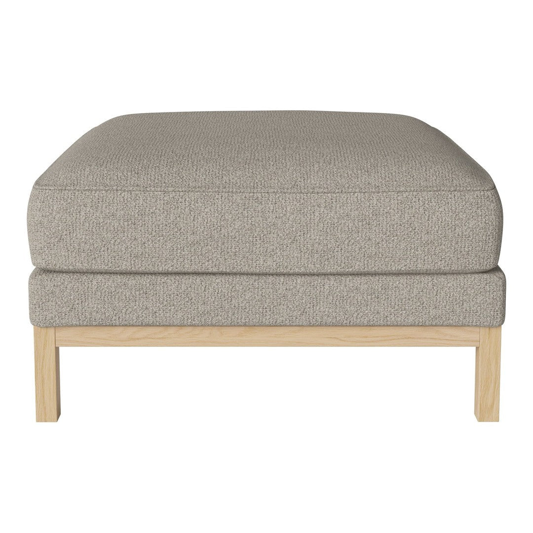 Light gray upholstered ottoman with a smooth texture and natural wood legs, perfect for modern decor.